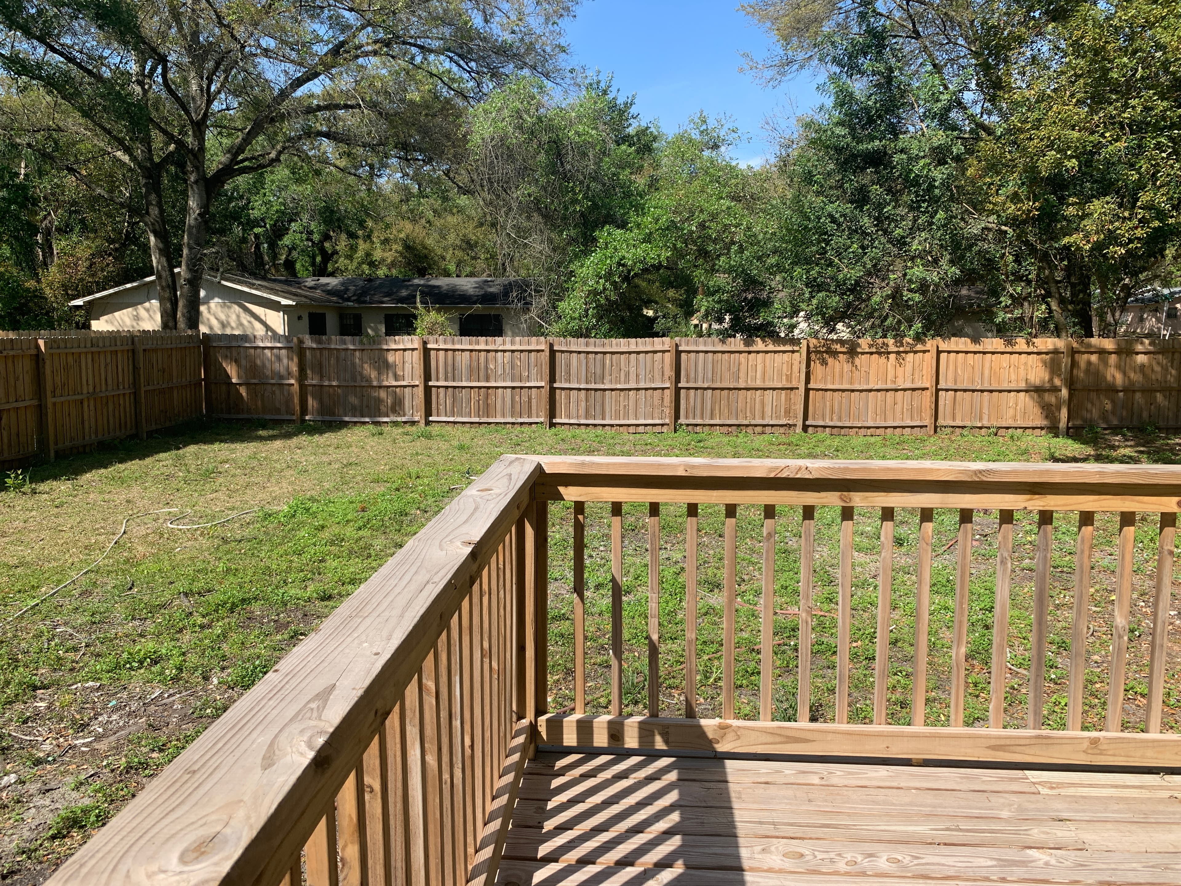 New cedar deck and wood privacy fence — Blue Diamond Building, Jacksonville Beach FL