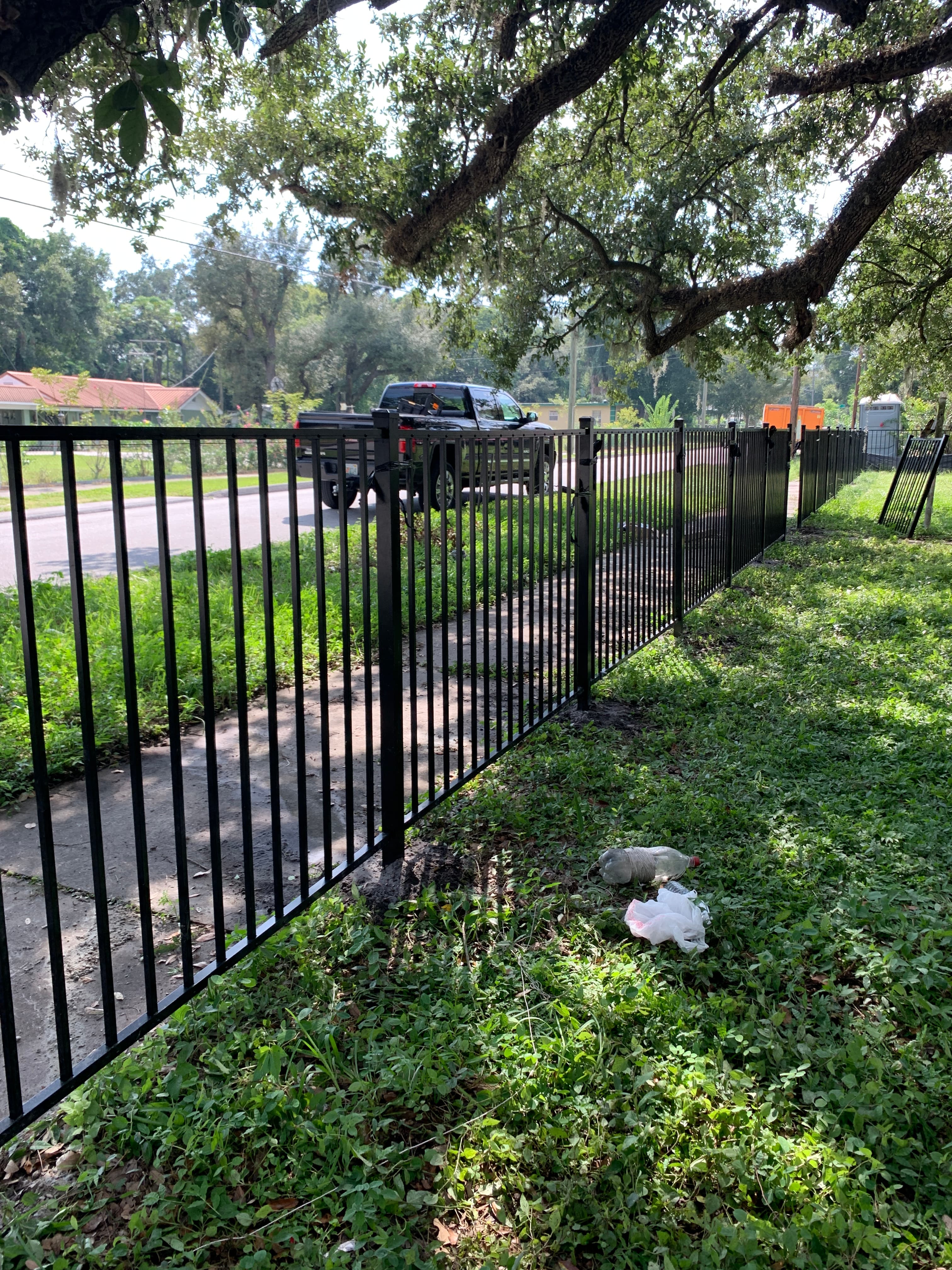 Black iron driveway gate installation — Blue Diamond Building, Jacksonville FL