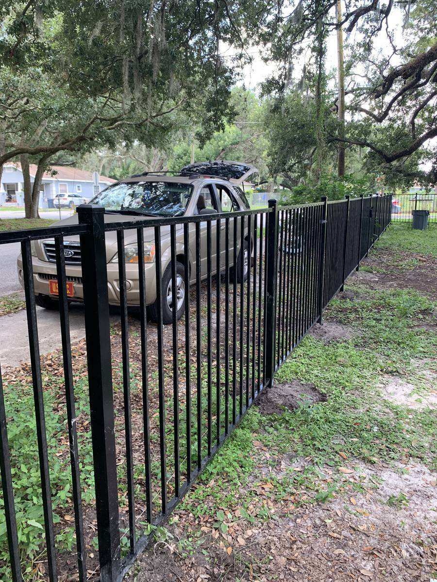 Long run of custom black iron fence on Florida property — Blue Diamond Building