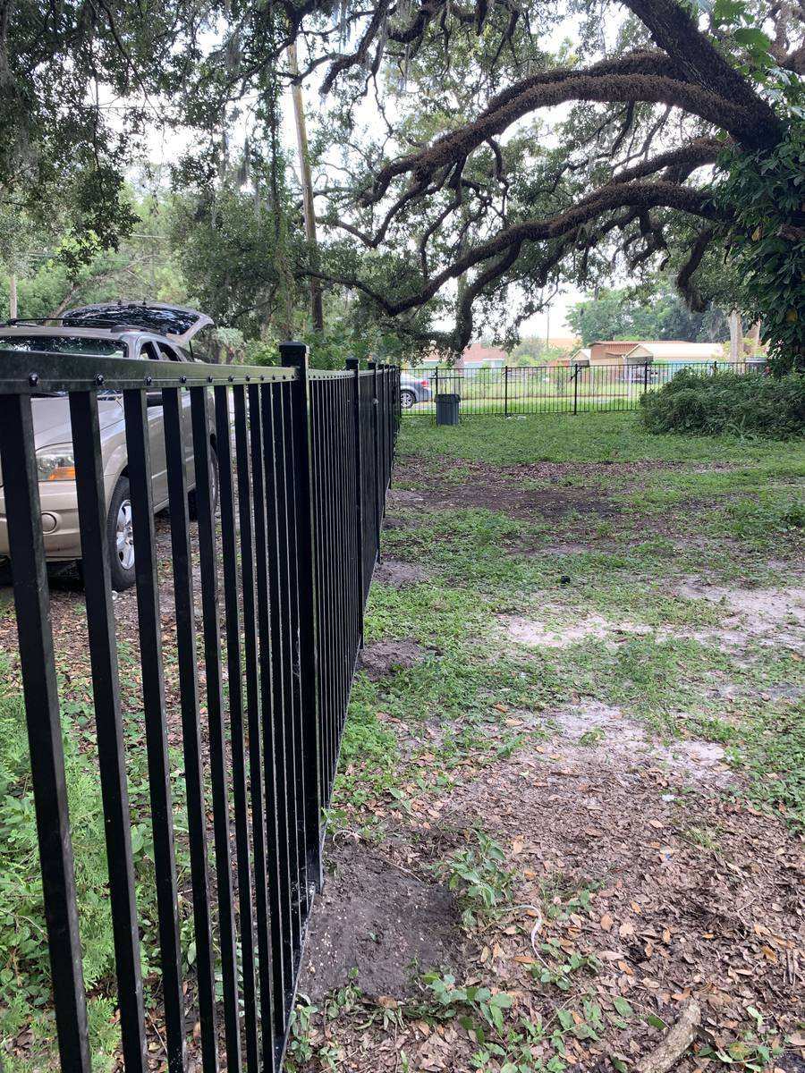 Custom black iron fence along walkway — Blue Diamond Building, Jacksonville FL
