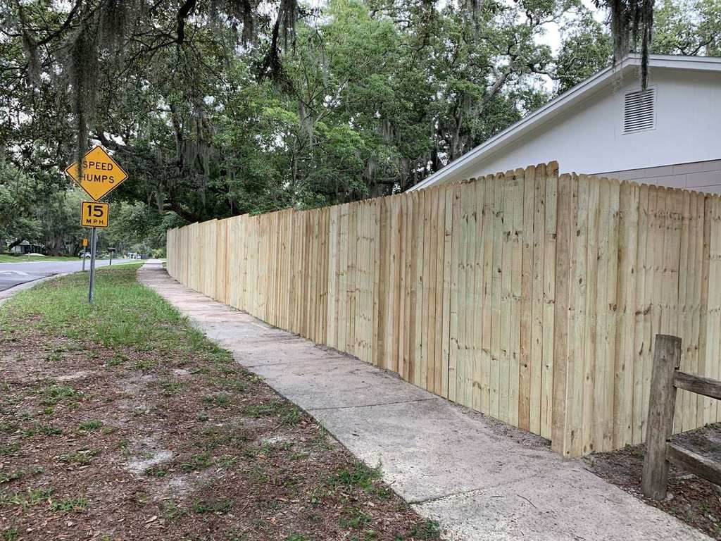 Fresh wood privacy fence in Florida setting — Blue Diamond Building