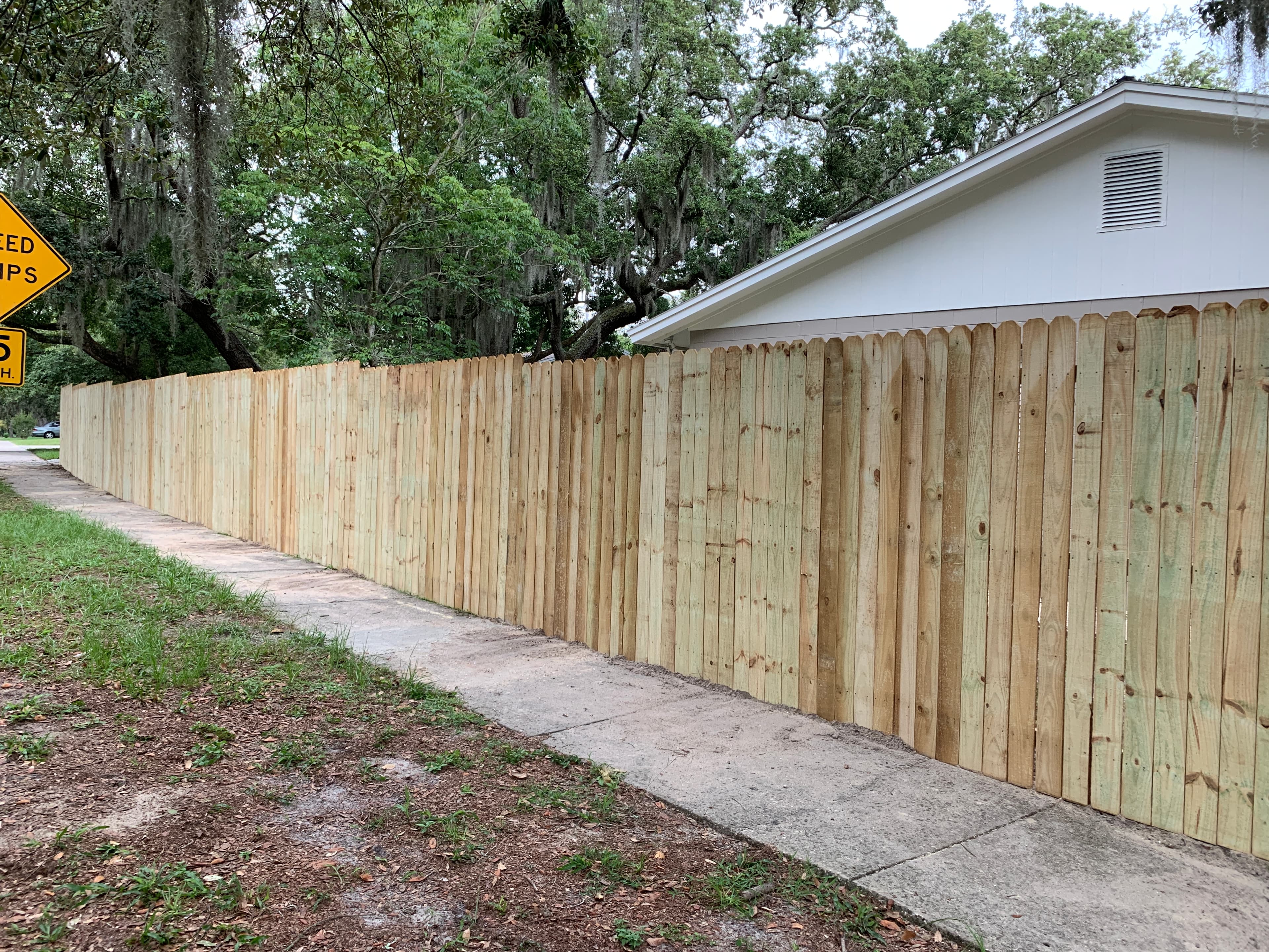 New wood privacy fence along street — Blue Diamond Building fence contractor Jacksonville FL