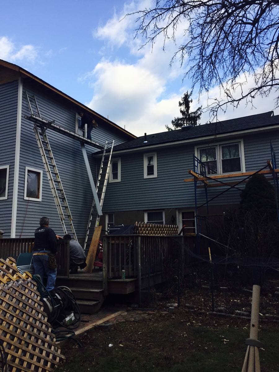 Completed gray fiber cement siding installation on Florida home — Blue Diamond Building