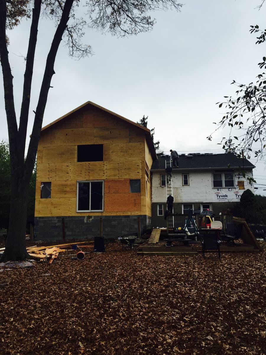 Blue Diamond crew installing siding — workers on ladders