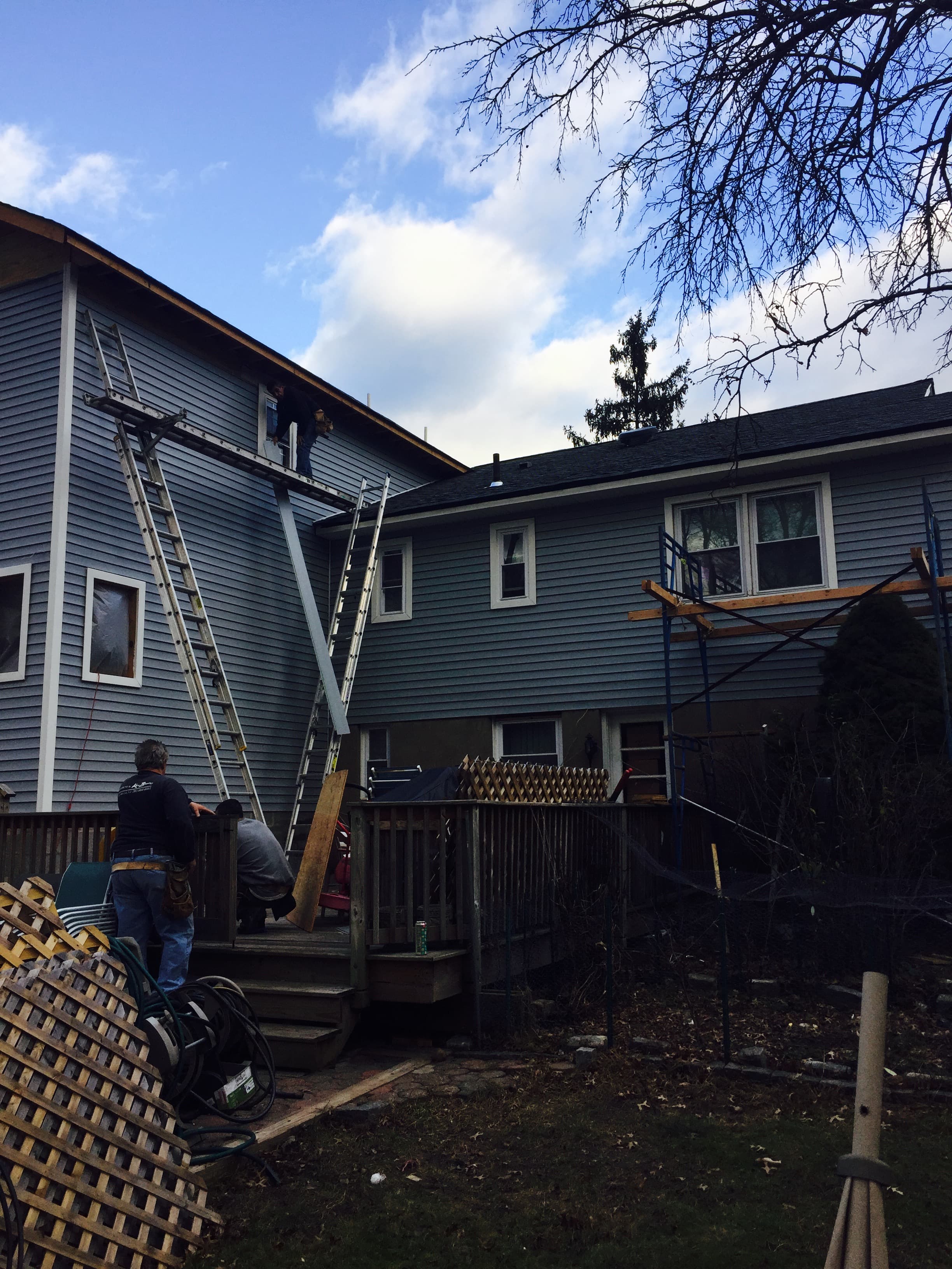 Blue Diamond Building siding crew installing fiber cement siding — Jacksonville Beach FL